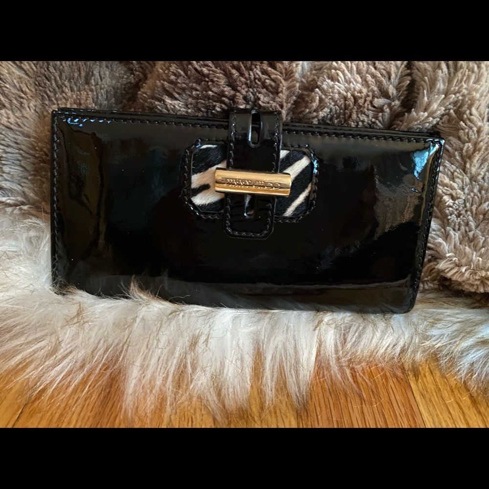 Patent leather and pony hair wallet.